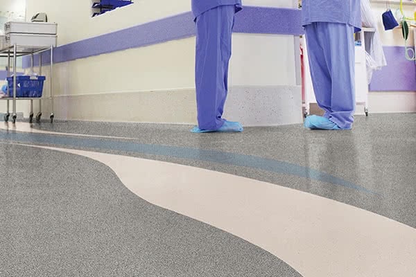Doctors working in a busy hospital corridor